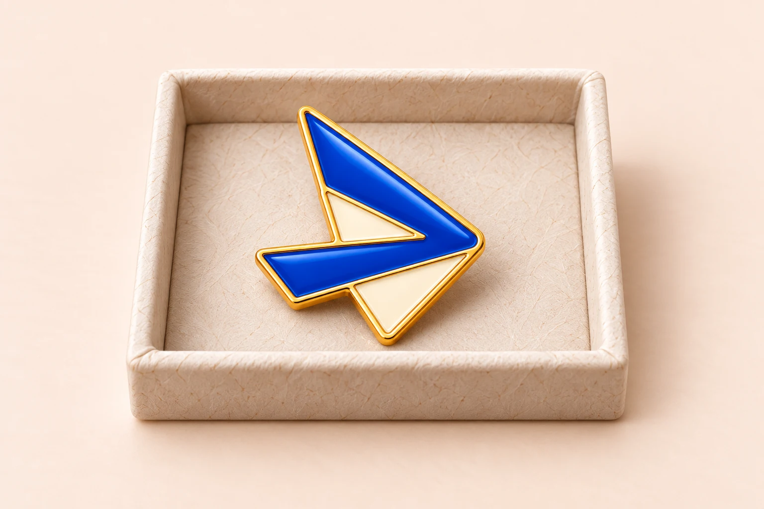 Illustrative company logo pin displayed in a shallow sample tray